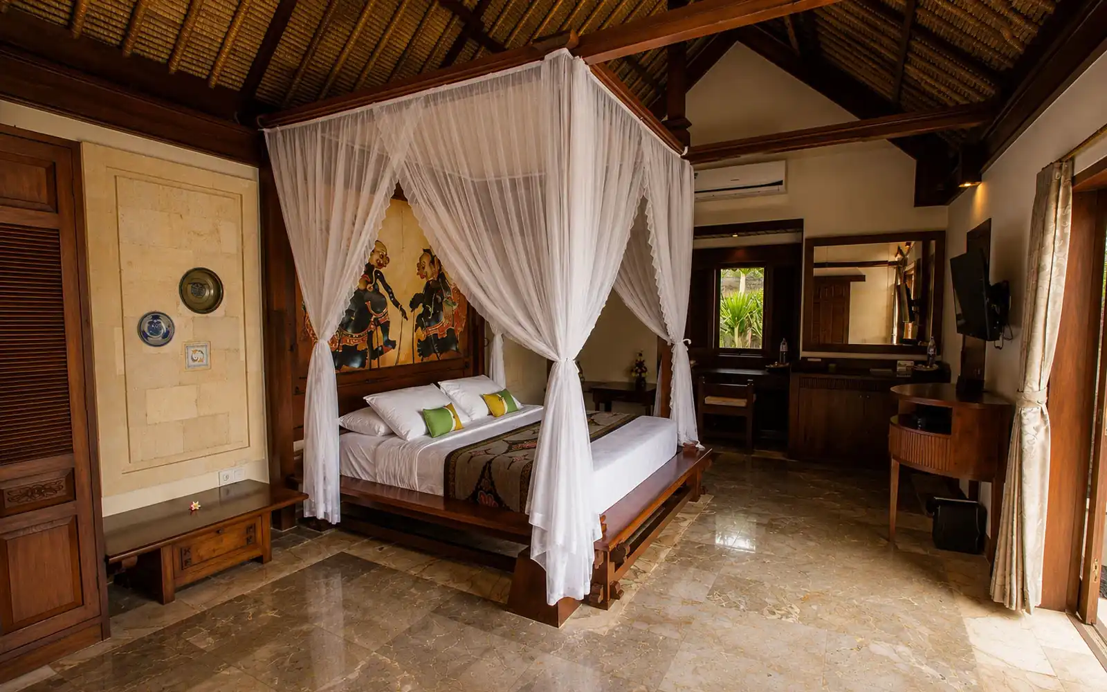 Traditional Balinese bedroom inside Sani One-Bedroom Villa in Seminyak Bali